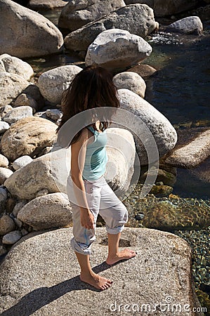 Barefoot on riverside Stock Photo