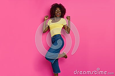 Barefoot Young Black Woman Is Cheering And Laughing Stock Photo