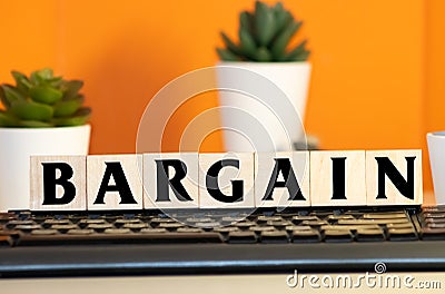 BARGAIN word made with building blocks isolated on white Stock Photo