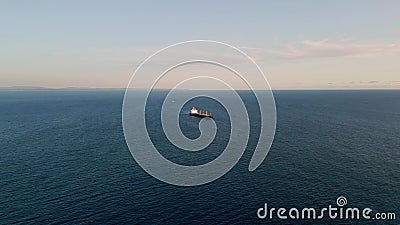 Barge carrier floating ocean surface drone view. Container tanker moving in sea Stock Photo