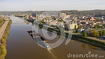 Barge Carries Coal Along Kanawha River and Charleston West Virgina Stock Photo