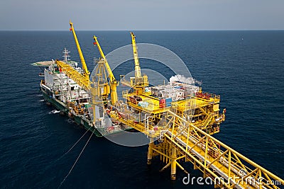 Barge installation platform in offshore oil and gas industry, Supply boat or barge support worker for work on offshore platform Stock Photo