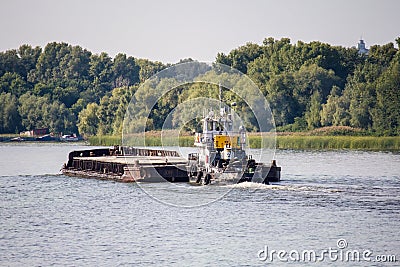 The barge sails along the Dnieper River Editorial Stock Photo