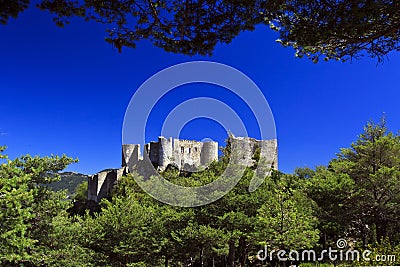 Bargeme Castle rising above the thickly forested Var Stock Photo
