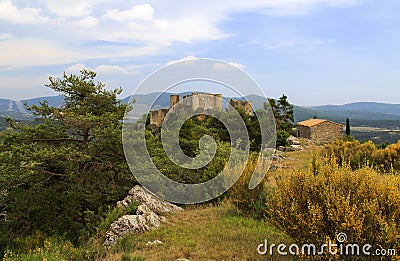 Bargeme and its Castle with Yellow Broom Stock Photo