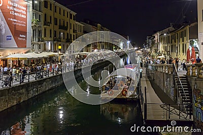 Barges on Naviglio Grande embankment at night life time , Milan, Editorial Stock Photo