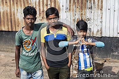 Barisal, Bangladesh, February 27 2017: Three teenagers pose at the pier Editorial Stock Photo