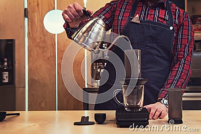 Barista brewing aeropress coffee Stock Photo