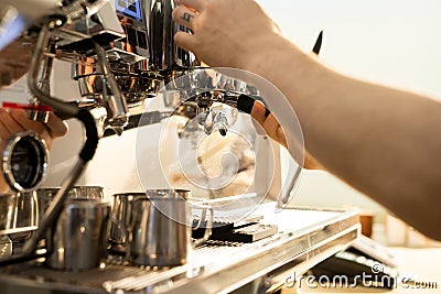 Barista brewing coffee using espresso machine Stock Photo