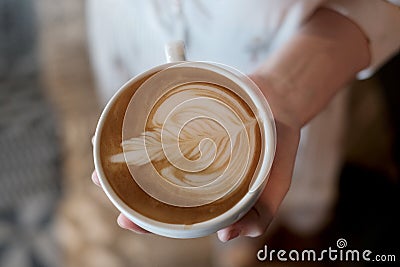 Barista creating latte art coffee. Stock Photo