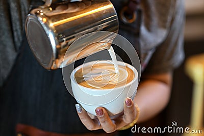 Barista made coffee latte leaf shaped Stock Photo