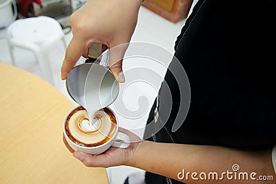 Barista made a latte art Stock Photo