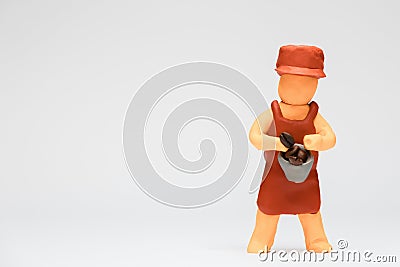 Barista made from plasticine on white background, aligned to the right Stock Photo