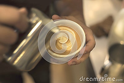 Barista make coffee latte art. vintage Stock Photo