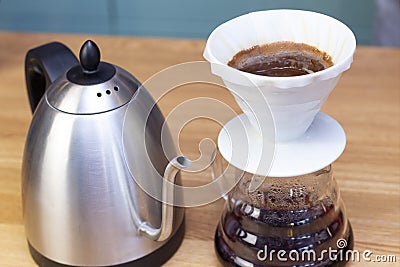 Barista makes espresso using a funnel. Stock Photo