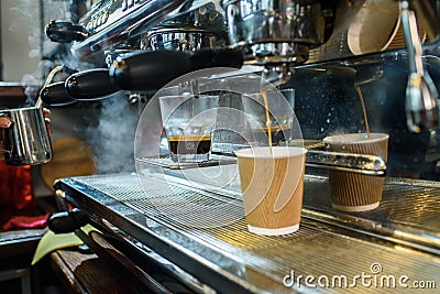Barista makes fresh and tasty coffee on a coffee machine Stock Photo