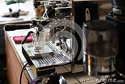 Barista Making Espresso with Coffee Machine Stock Photo