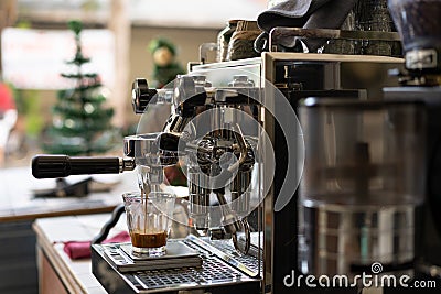 Barista Making Espresso with Coffee Machine Stock Photo