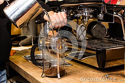 Barista making non traditional coffee in french press Stock Photo