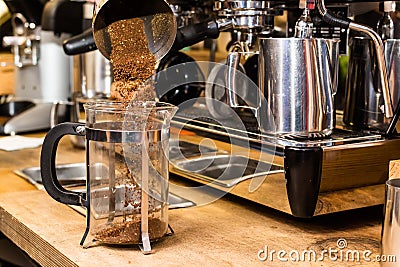 Barista making non traditional coffee in french press Stock Photo