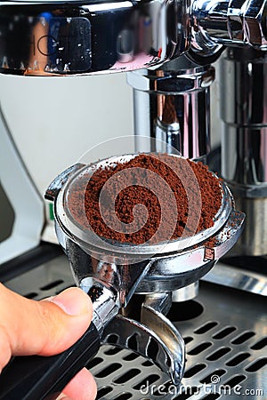 Barista take coffee grind to making Espresso Stock Photo