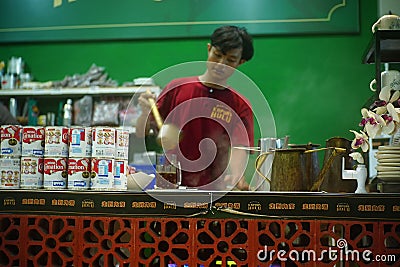 Baristas at the kopi tiam or Chinese Indonesian Coffee shop in Surabaya, Indonesia. Editorial Stock Photo