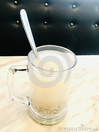 Barley water in glass. Vertical photo image. Stock Photo