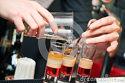 Barman or bartender preparing alcohol cocktail in restaurant Stock Photo