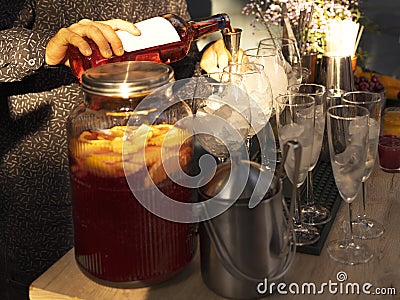 Barman preraring aperol spritz cocktail in outdoor summer bar Stock Photo