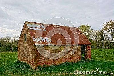 Barn. Brick built tin roof. Stock Photo