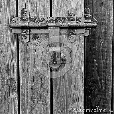 Barn door sliding bar / lock detail, black and white, closeup Stock Photo