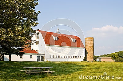 Barn with Gambrel Roof and Silo Stock Photo