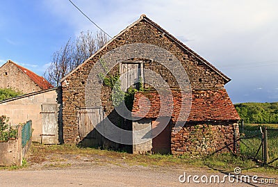 Barn and outbuilding with red tiled roof Stock Photo