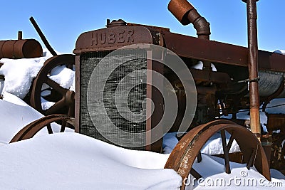 Old Huber tractor in a snowdrift Editorial Stock Photo