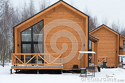 Barnhouse style house. The house is surrounded by snow. Winter and frost. Architectural style Stock Photo