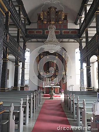 Baroque altar in the two-story interior of a church in Maroldsweisach Editorial Stock Photo