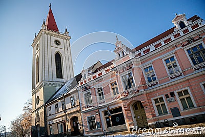 Baroque bell tower called Blatenska vez in winter, Narrow picturesque street, renaissance historical buildings with snow, Blatna Editorial Stock Photo