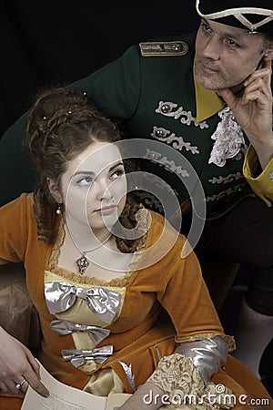 Baroque couple reeding book Stock Photo