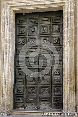 A baroque door on the facade one of the churches in the historial center of Matera town, Basilicata, Italy. Stock Photo