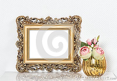 Baroque golden picture frame and rose flowers. Vintage style moc Stock Photo