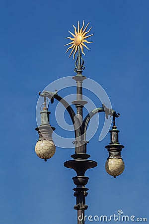 Baroque lamp with ornament of gold-plated sun. Prague. Stock Photo