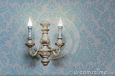 Baroque ornament texture and wall lamp. Vintage lighting sources Stock Photo