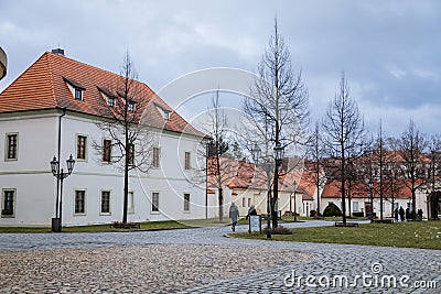 Baroque white benedictine monastery Brevnov with church, Medieval Basilica of St. Marquette, Garden and park, abbey under snow in Editorial Stock Photo