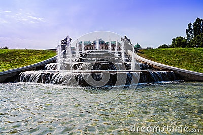 old big ancient fountain made of white marble. Beautiful cascading fountain with antique sculptures in the park Stock Photo