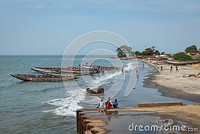BARRA, THE GAMBIA - NOVEMBER 18, 2019: Pleople workingh at the beach in Barra, Gambia Editorial Stock Photo
