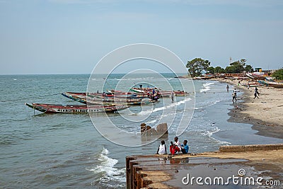 BARRA, THE GAMBIA - NOVEMBER 18, 2019: Pleople workingh at the beach in Barra, Gambia Editorial Stock Photo