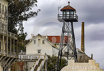 Barracks and guardhouse with its watchtower of the federal prison of Alcatraz Island of the United States in the bay. Stock Photo