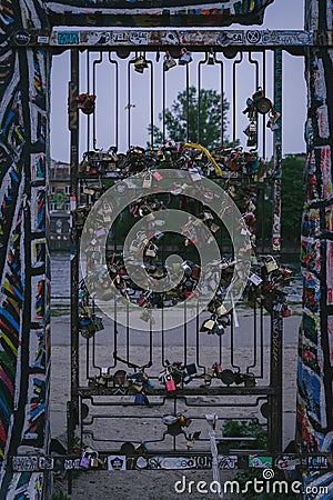 Barred gate with many locks Editorial Stock Photo