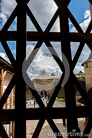 Through the barred window the courtyard of the castle is visible Stock Photo