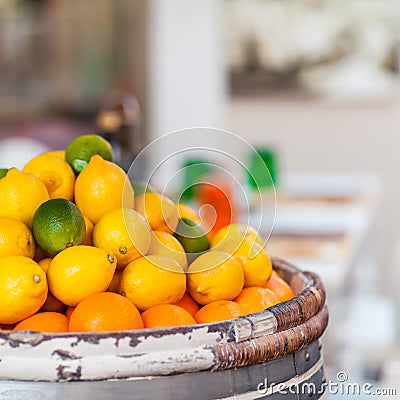 Barrel of Fresh Lemons, Limes and Oranges on Street Market Stock Photo